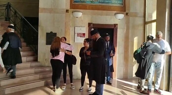 Aplazan medida de coerción a cuatro policías acusados de matar a tiros a cinco hombres en Santiago