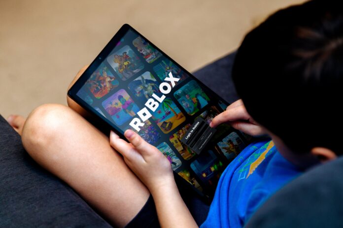 Little,Boy,Playing,Roblox,Game,On,A,Tablet.,Roblox,Is